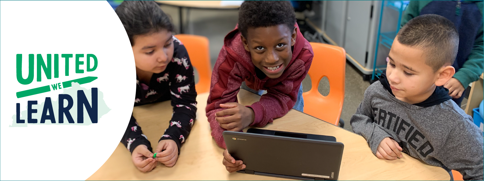 threes kindergarten students in front of laptop